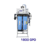 Crystal Quest 1800 GPD whole house reverse osmosis system with two large blue filters, gauges, and brass rotary pump.