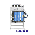 Crystal Quest 5000 GPD whole house reverse osmosis system with three blue filters and a 1.5 HP pump.
