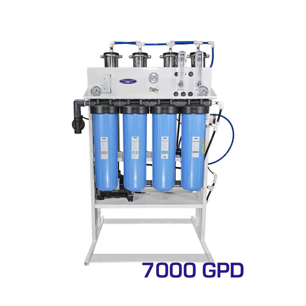 Crystal Quest 7000 GPD whole house reverse osmosis system with four blue filters on a white frame.