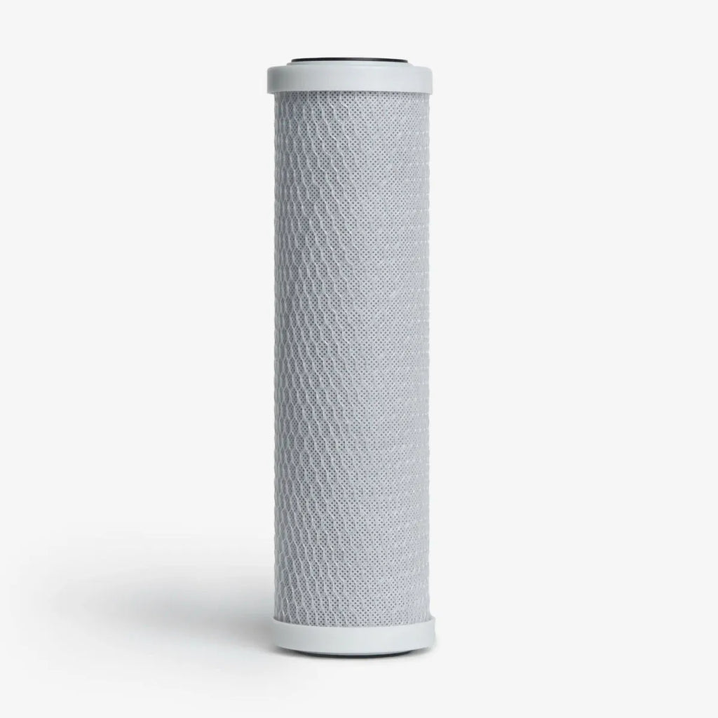Crystal Quest 5-Micron Carbon Block Filter Cartridge, 2-7/8” x 9-3/4”, with white end caps.