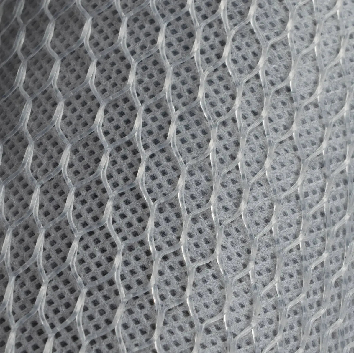 Close-up of the white polypropylene netting and polyolefin casing of a Crystal Quest 5-Micron Carbon Block Filter.