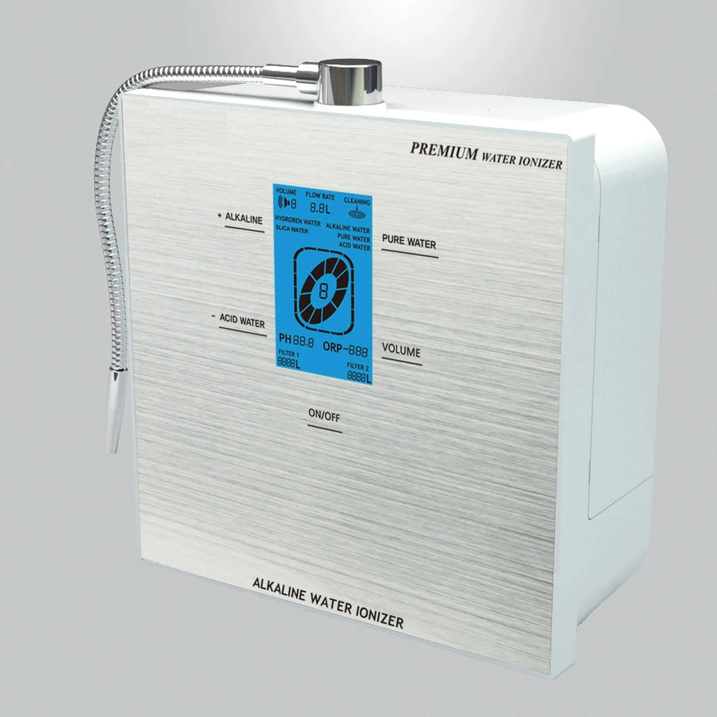 Water For life Angled view of the Genesis Steel countertop alkaline water ionizer showing its silver housing, digital controls, and dispensing hose.