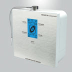 Water For life Angled view of the Genesis Steel countertop alkaline water ionizer showing its silver housing, digital controls, and dispensing hose.