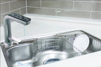 Water for Life Rio alkaline water ionizer digital faucet dispensing water into a stainless steel kitchen sink.