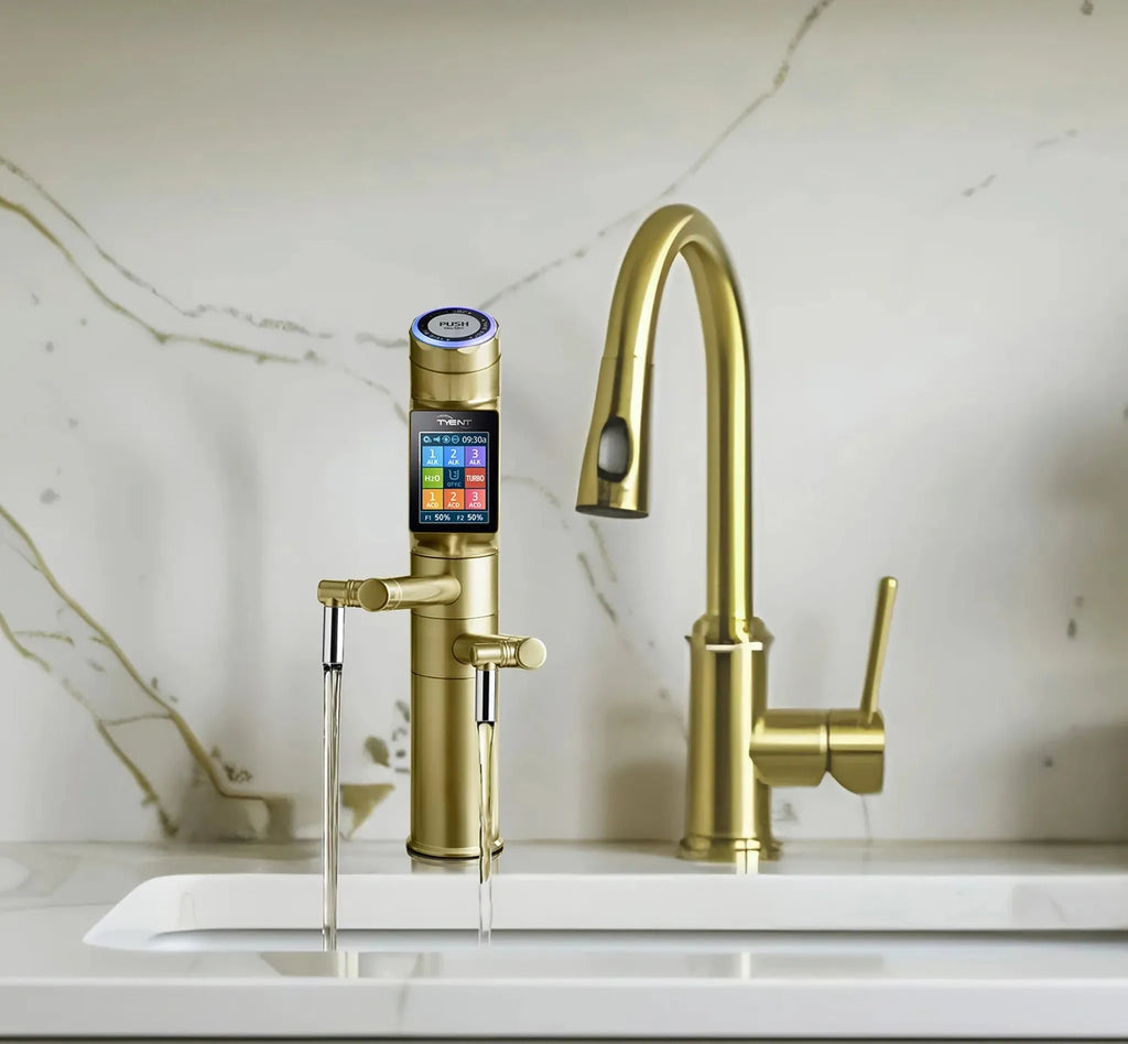 Tyent UCE-13 PLUS Gold built-in water ionizer faucet dispensing water beside a gold kitchen faucet